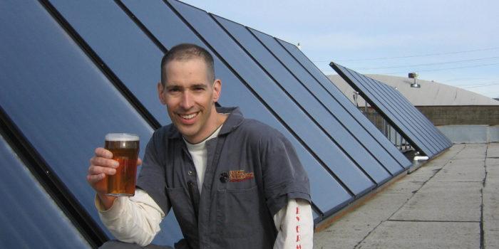 Brewer Alex Stiles and a pint of his Solar Flare Ale.