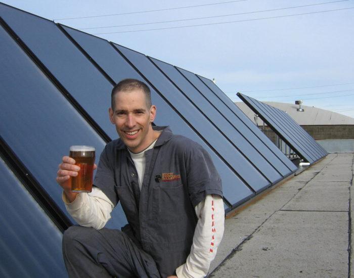 Brewer Alex Stiles and a pint of his Solar Flare Ale.